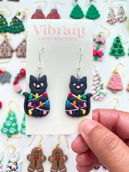 Christmas Cat tangled in Lights