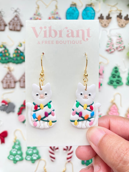 Christmas Cat tangled in Lights