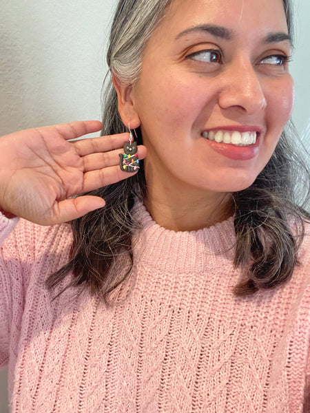 Christmas Cat tangled in Lights